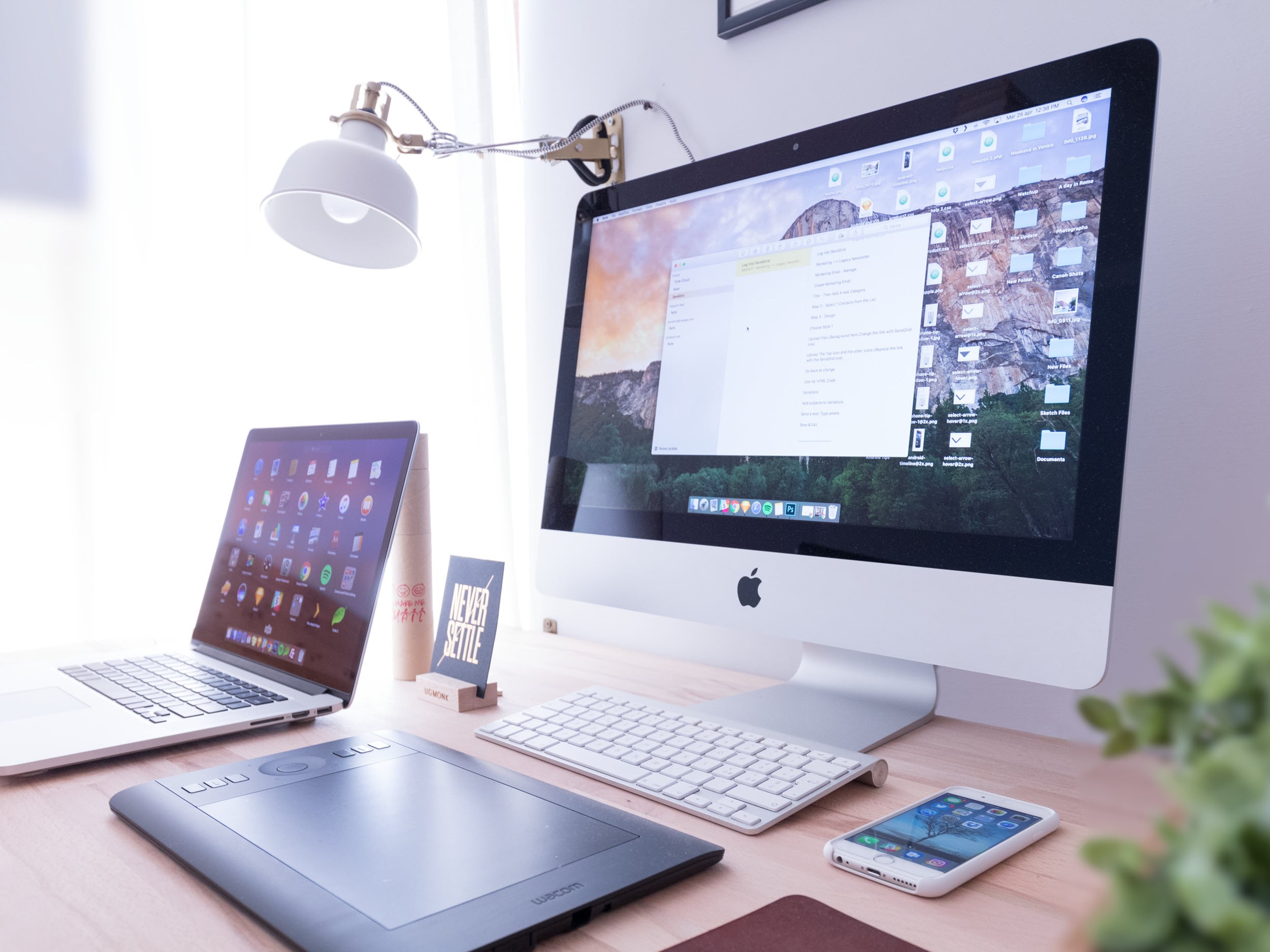 Desktop, laptop and phone on tidy desk